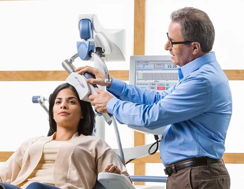The BrainsWay device positioned during treatment.