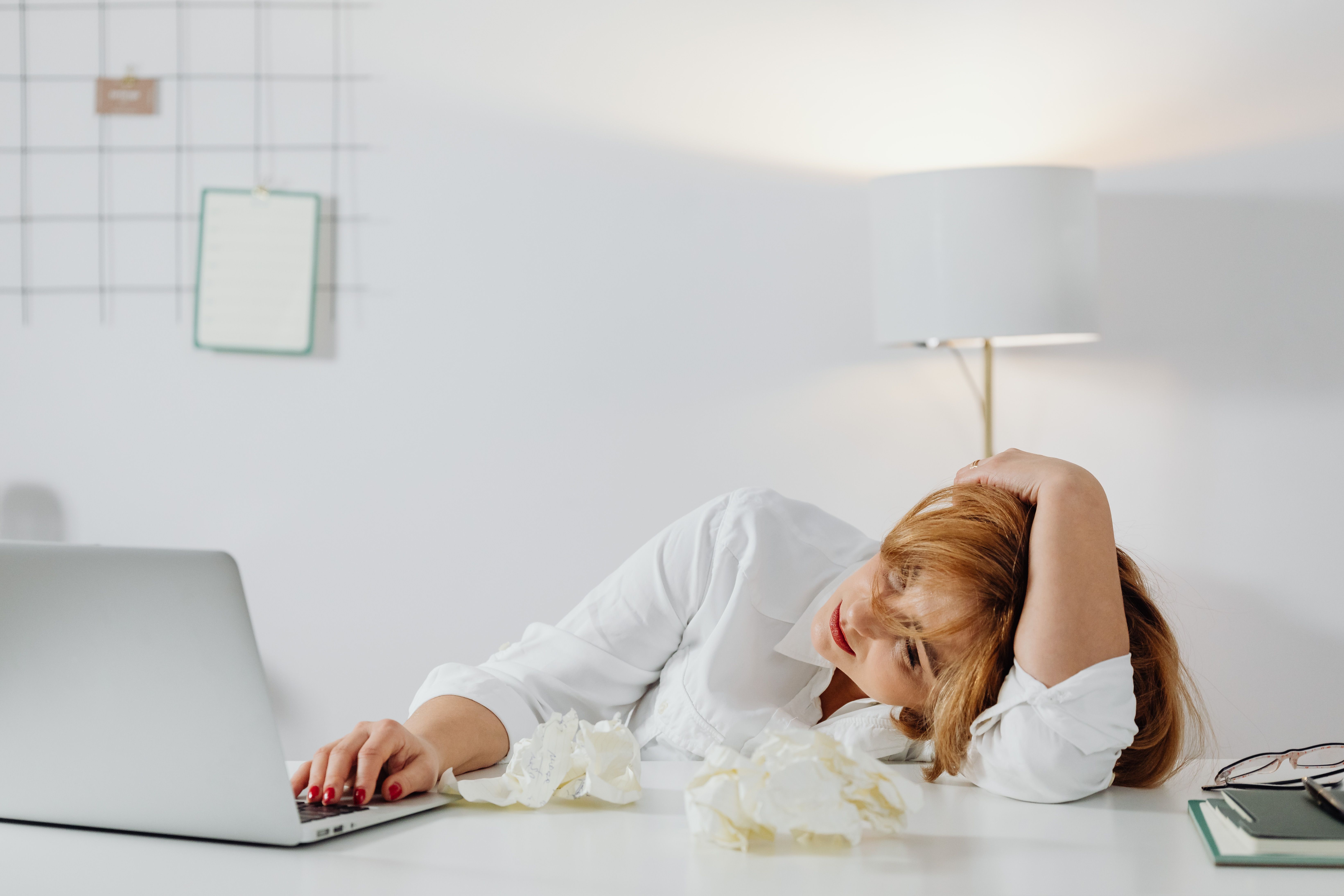 Patient resting in bed, representing low motivation before treatment.